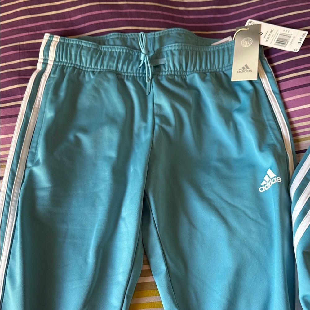 Adidas women’s Teal Joggers with White Stripes